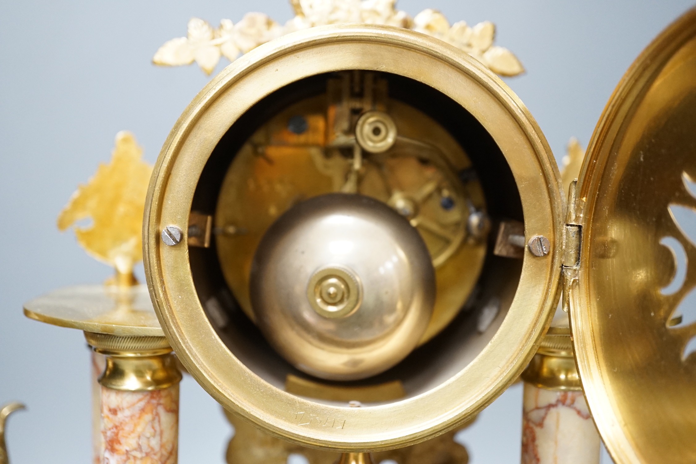 A French gilt metal and marble clock garniture, 38cm